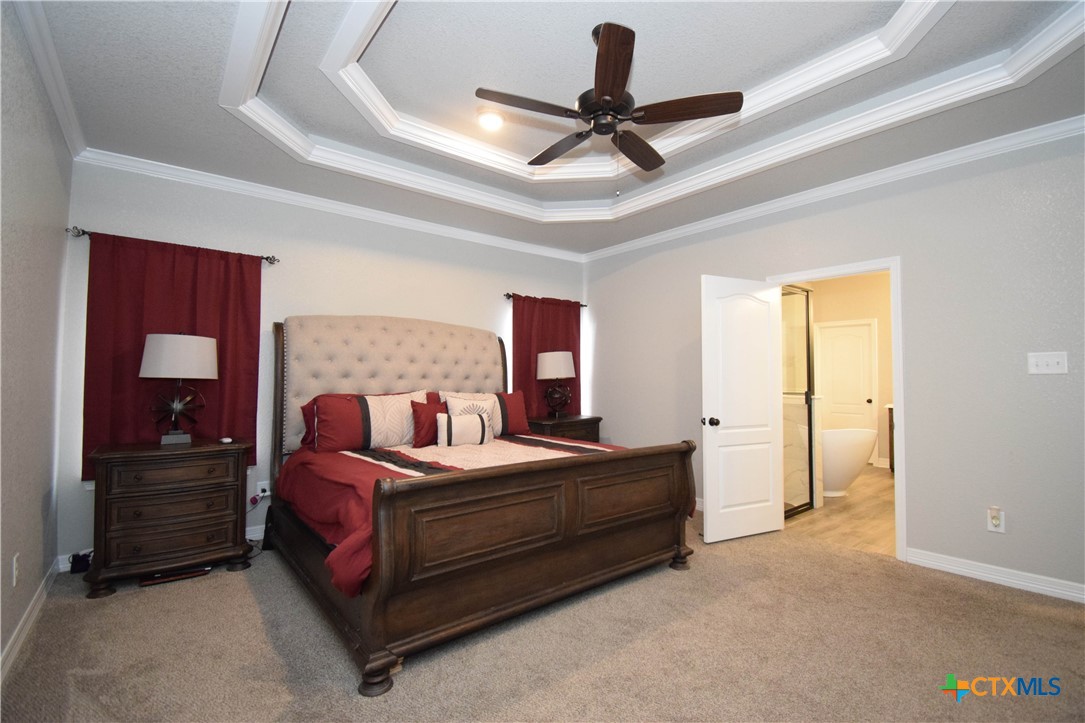 7623 Palladium Loop Killeen, TX 76542 - Photo 29 of 48 a bedroom with a bed and a ceiling fan