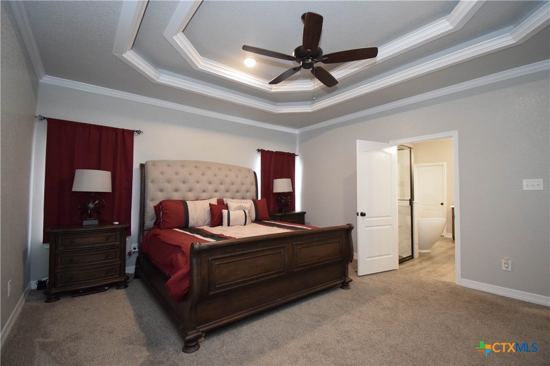 7623 Palladium Loop Killeen, TX 76542 - Photo 30 of 48 a bedroom with a bed and a ceiling fan