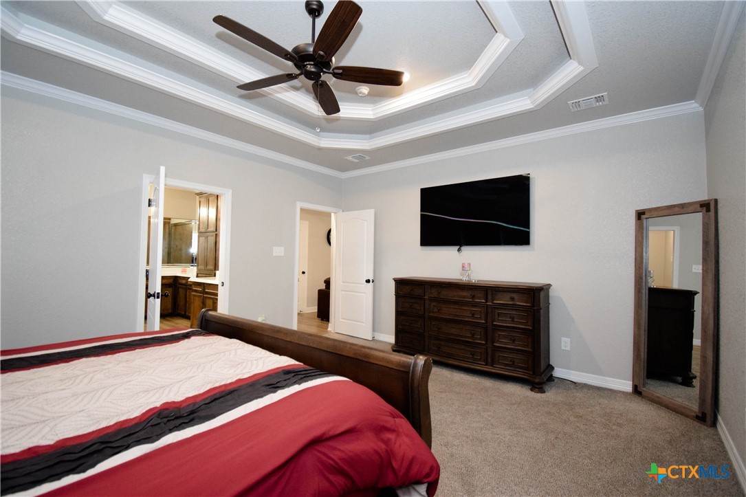 7623 Palladium Loop Killeen, TX 76542 - Photo 31 of 48 a bedroom with a bed and a flat screen tv