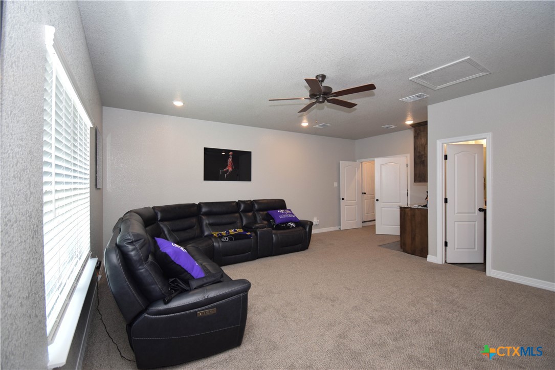 7623 Palladium Loop Killeen, TX 76542 - Photo 37 of 48 a bedroom with furniture and a ceiling fan