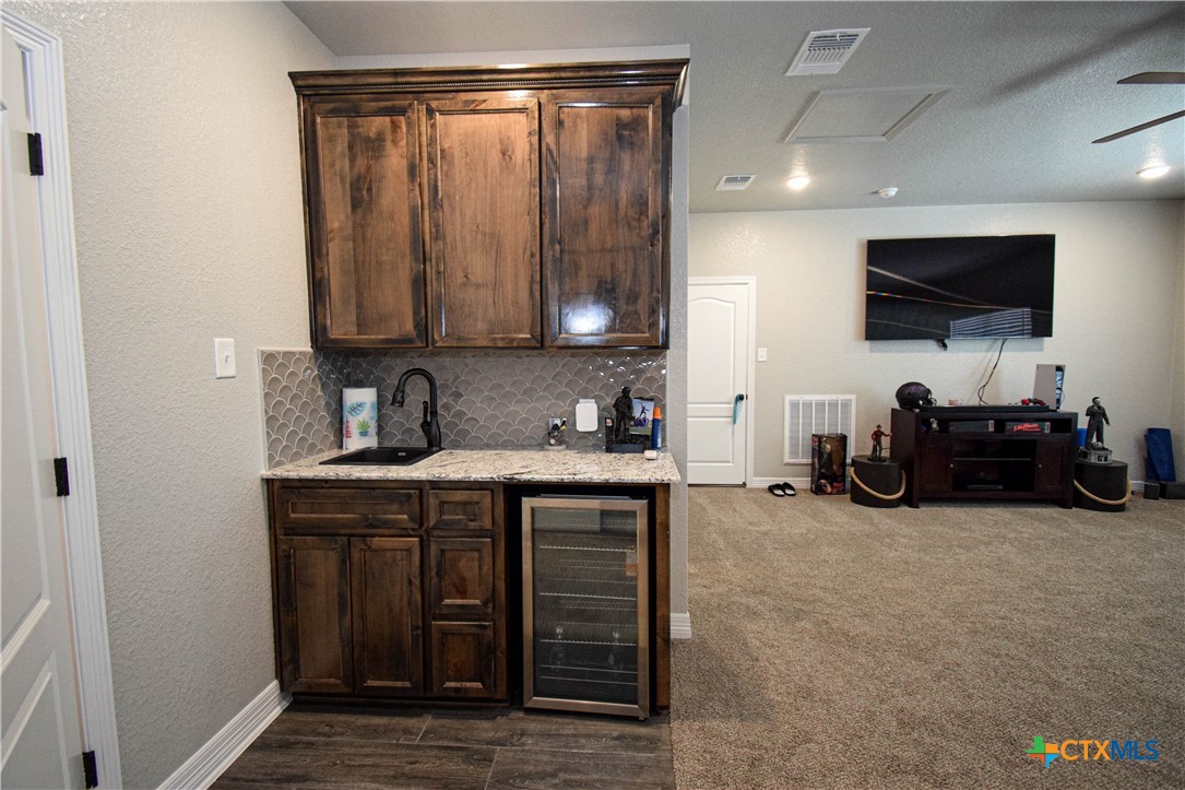 7623 Palladium Loop Killeen, TX 76542 - Photo 38 of 48 a kitchen with a sink and cabinets