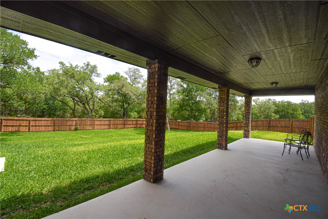 7623 Palladium Loop Killeen, TX 76542 - Photo 40 of 48 a view of a backyard with a garden and hardwood