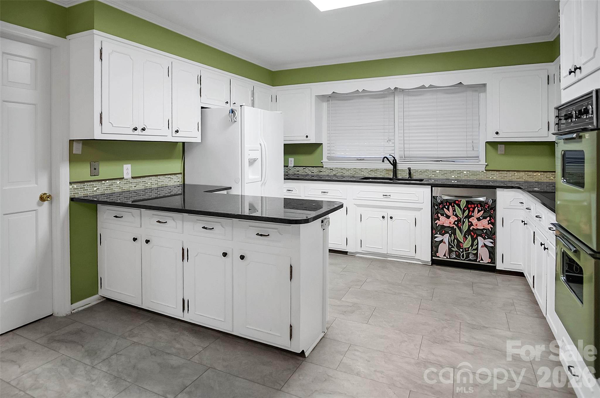 808 Old Mt Holly Road Stanley, NC 28164 - Photo 29 of 48 a kitchen with granite countertop white cabinets white stainless steel appliances and a sink