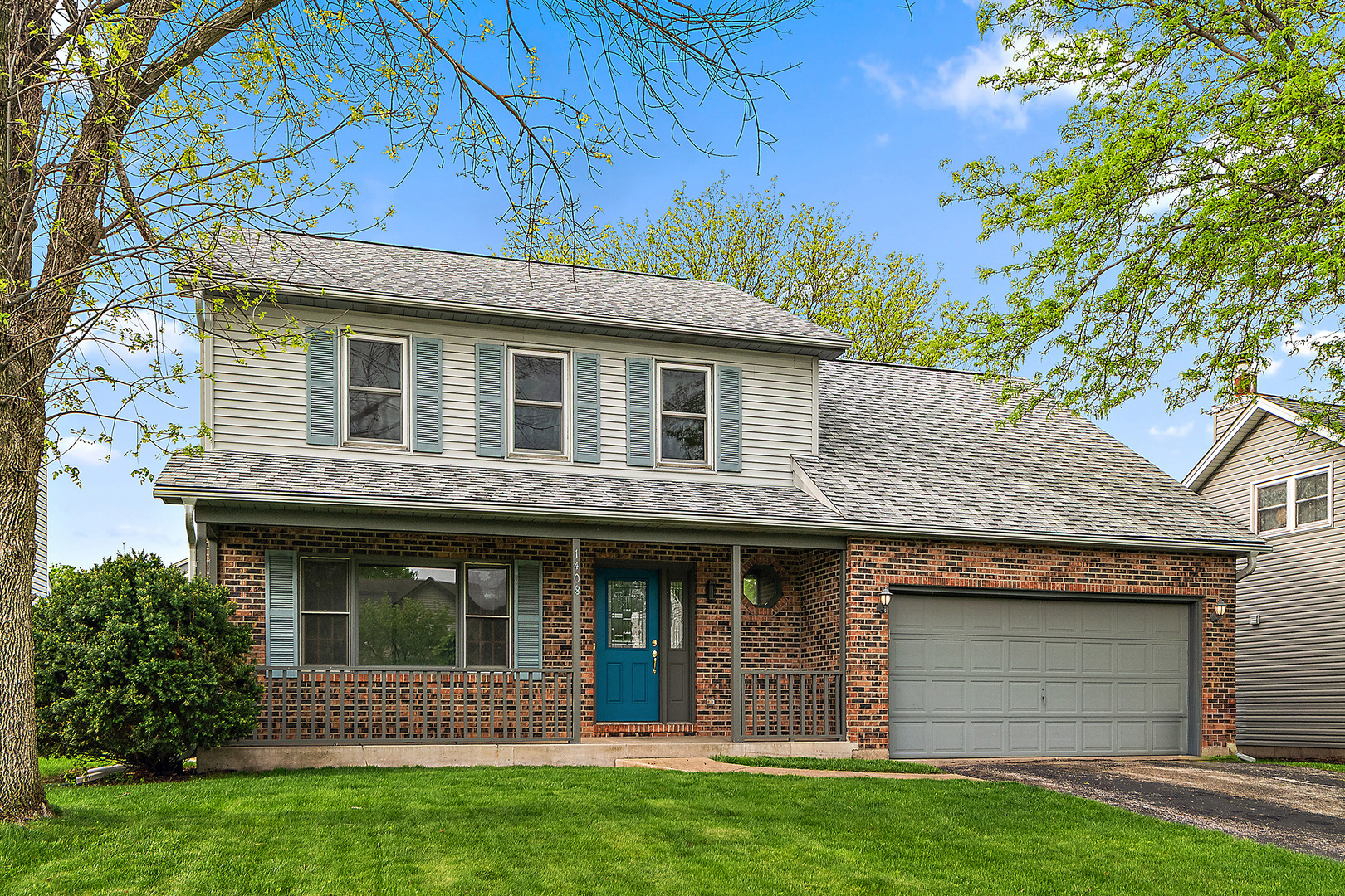 1408 Fawn Court Bolingbrook, IL 60490 - Photo 1 of 35 a front view of a house with a garden