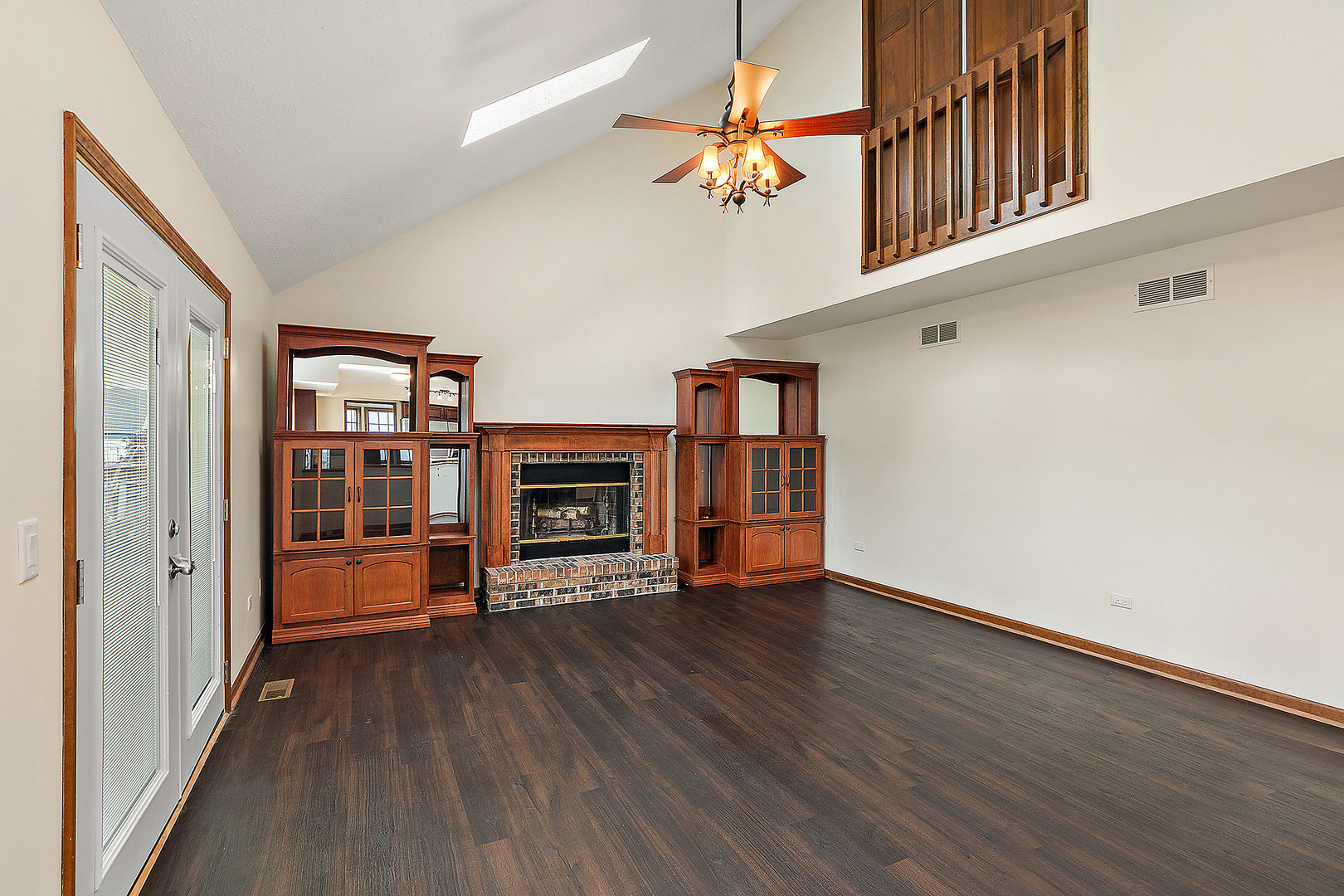 1408 Fawn Court Bolingbrook, IL 60490 - Photo 14 of 35 wooden floor fireplace and windows in an empty room