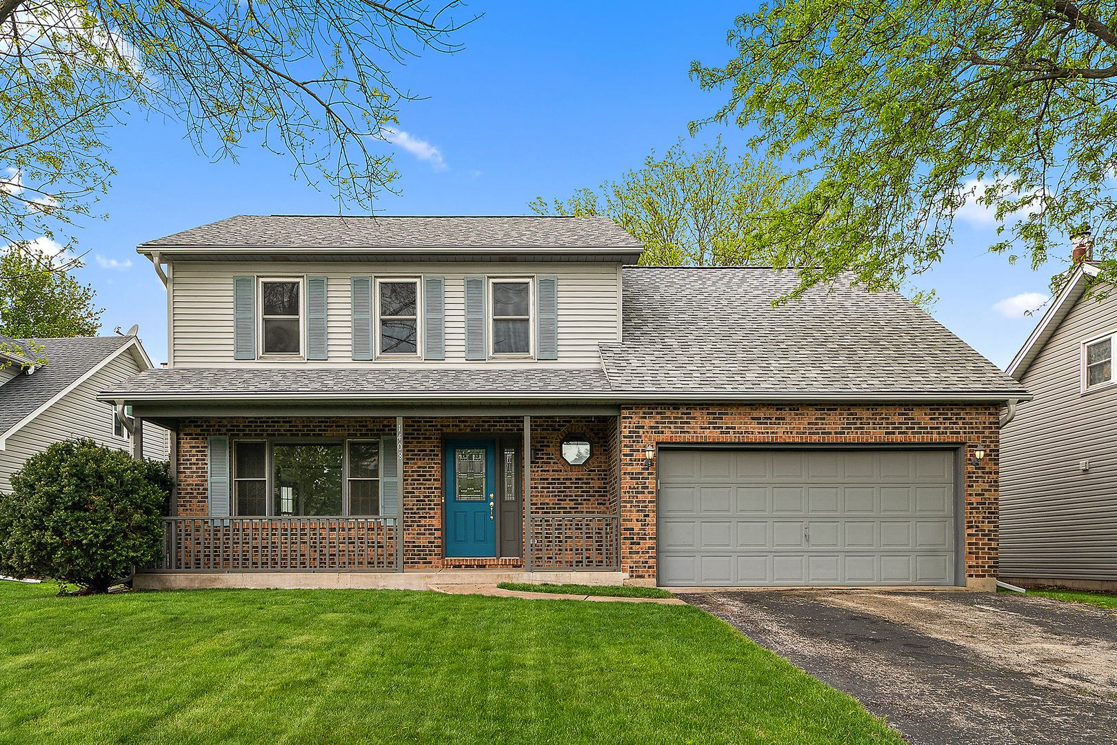 1408 Fawn Court Bolingbrook, IL 60490 - Photo 2 of 35 a front view of a house with a garden and yard