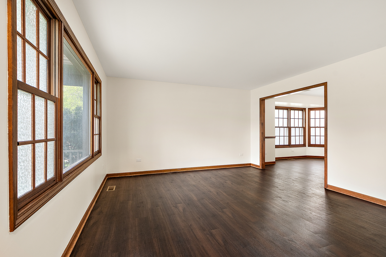 1408 Fawn Court Bolingbrook, IL 60490 - Photo 4 of 35 a view of an empty room with wooden floor and a window
