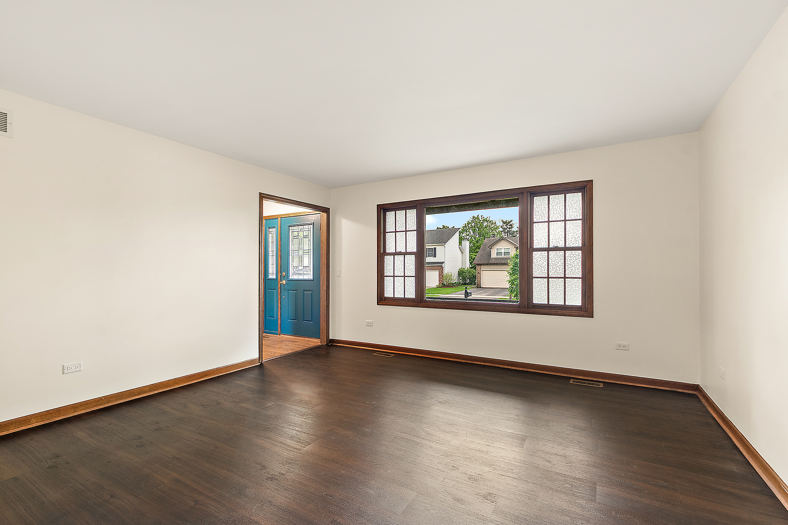 1408 Fawn Court Bolingbrook, IL 60490 - Photo 5 of 35 an empty room with wooden floor and windows
