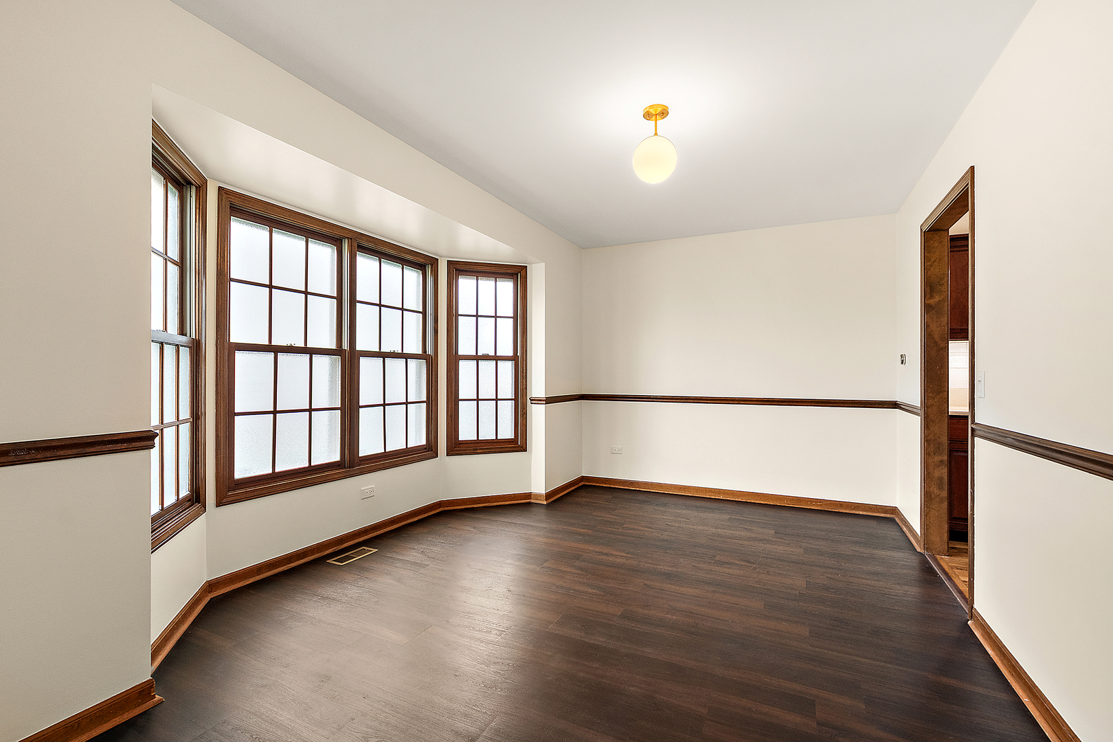 1408 Fawn Court Bolingbrook, IL 60490 - Photo 7 of 35 wooden floor in an empty room with a window