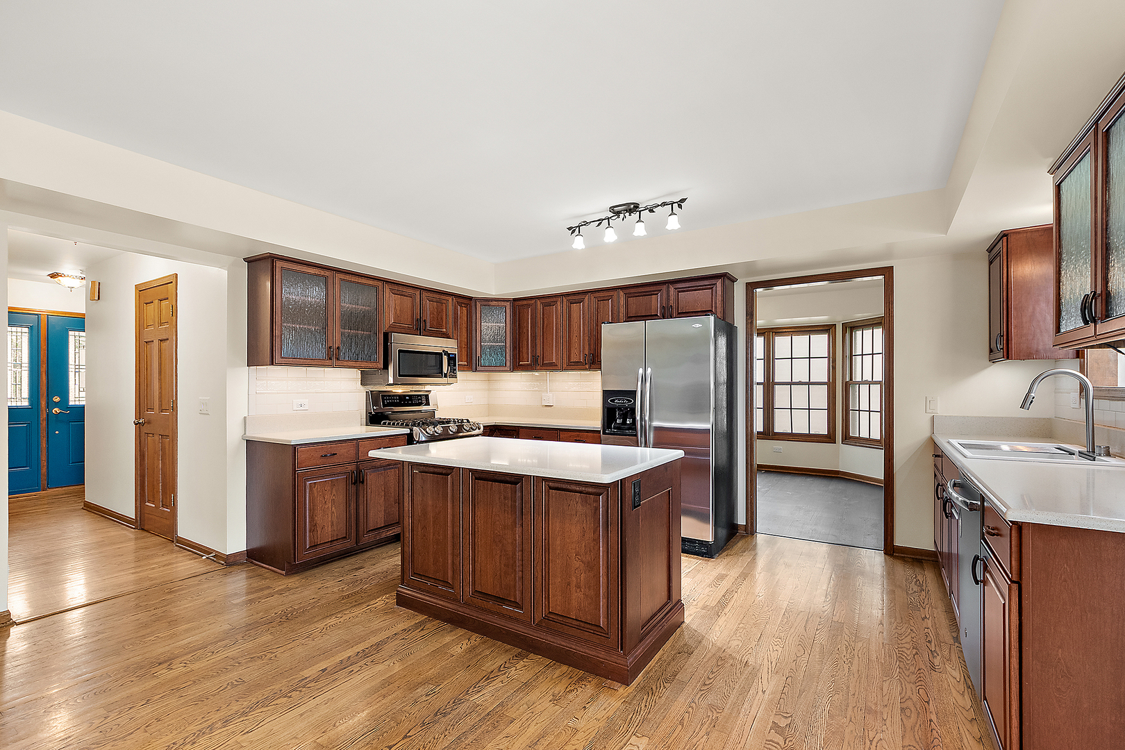 1408 Fawn Court Bolingbrook, IL 60490 - Photo 10 of 35 a kitchen with stainless steel appliances granite countertop a sink stove and refrigerator