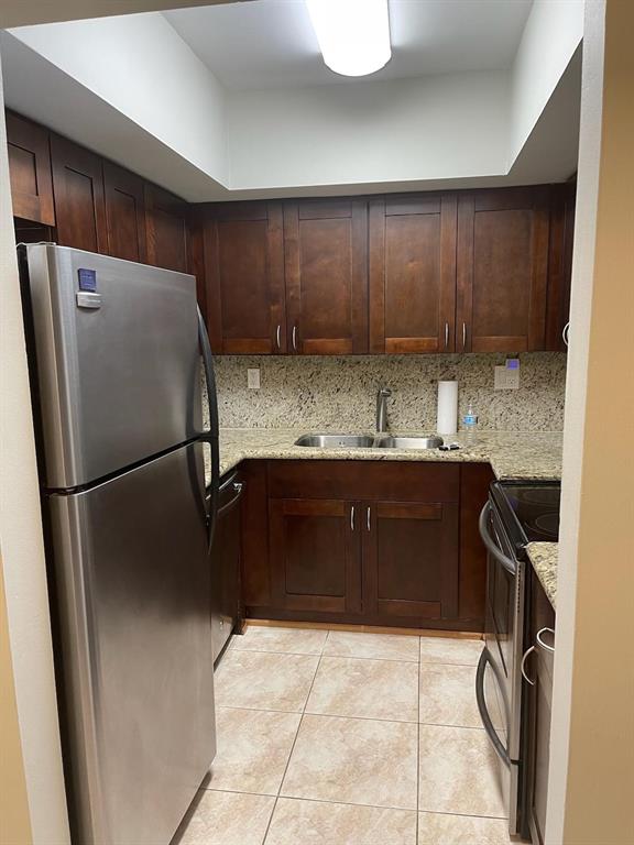 4521 Northeast 21st Avenue, Unit 2 Fort Lauderdale, FL 33308 - Photo 2 of 10 a kitchen with a refrigerator and a sink