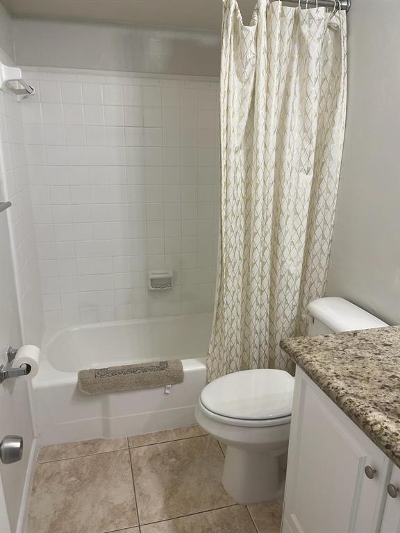 4521 Northeast 21st Avenue, Unit 2 Fort Lauderdale, FL 33308 - Photo 4 of 10 a bathroom with a granite countertop bathtub toilet and sink