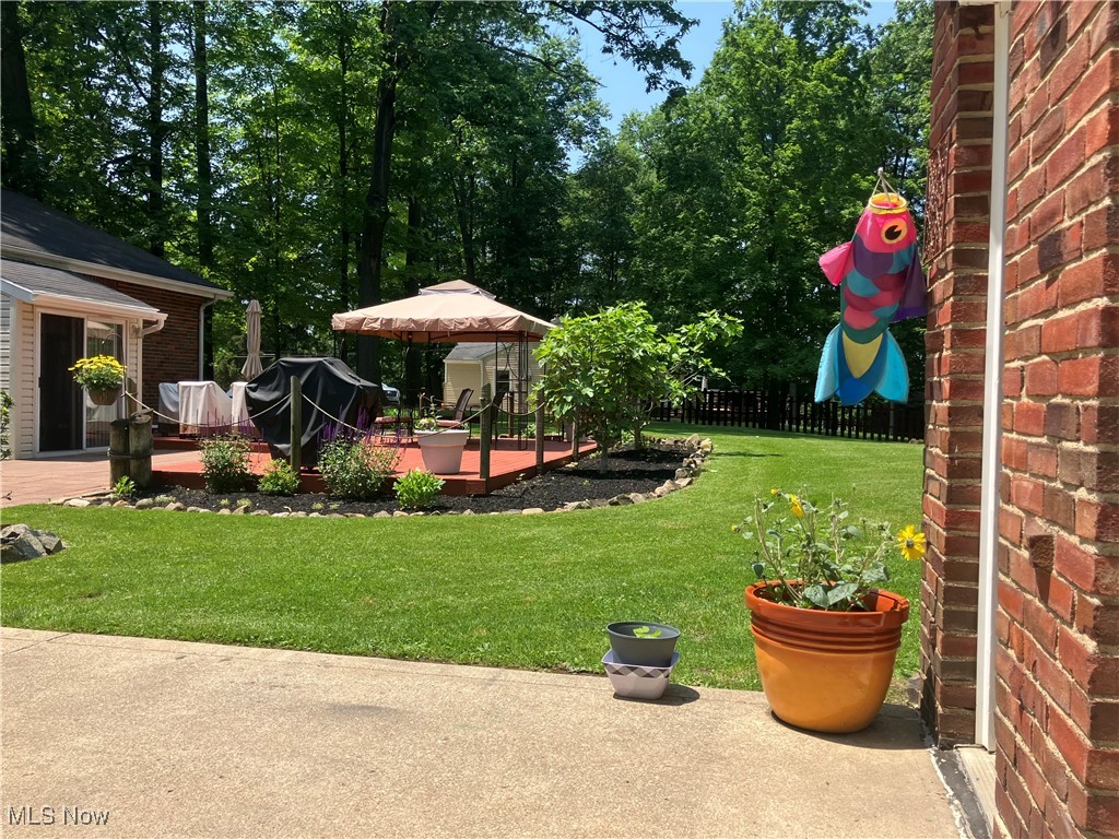 19005 Alexander Road Walton Hills, OH 44146 - Photo 5 of 15 View of yard with a patio and a wooden deck