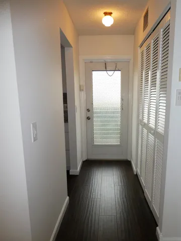 a view of a park with swimming pool and trees