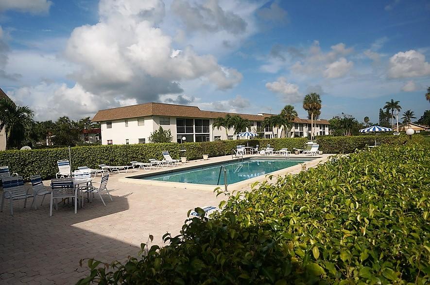 9855 Sandalfoot Boulevard, Unit 306 Boca Raton, FL 33428 - Photo 17 of 25 a view of a lake