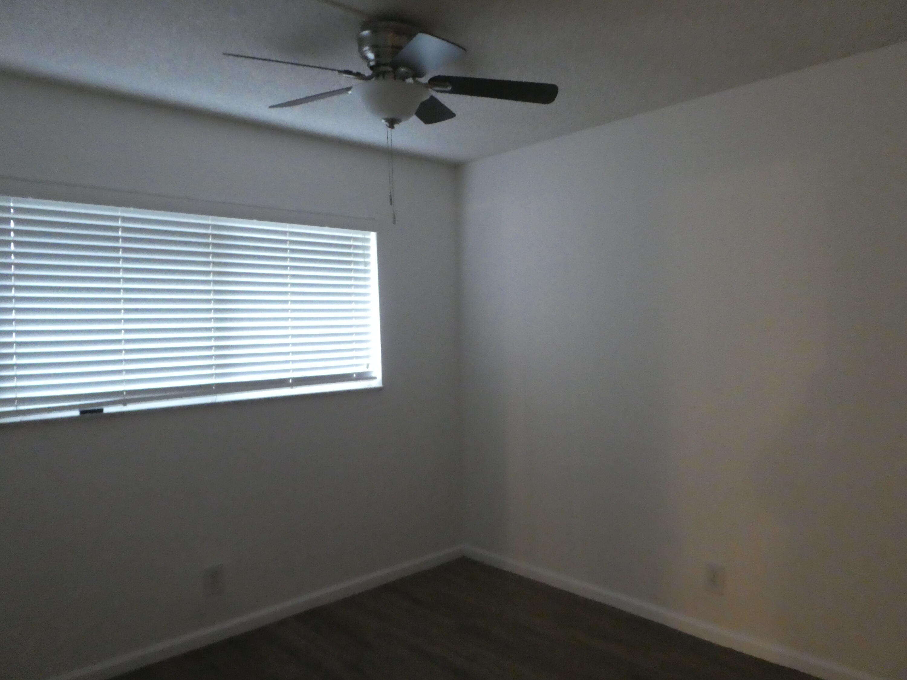 9855 Sandalfoot Boulevard, Unit 306 Boca Raton, FL 33428 - Photo 10 of 25 an empty room with a window