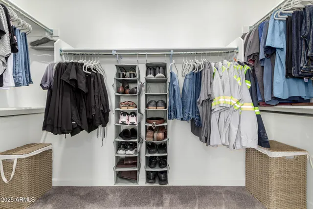a bathroom with a double vanity sink bathtub and next to a window