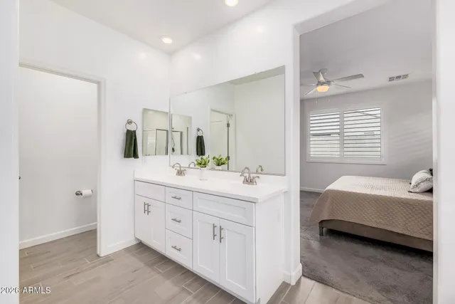 a view of kitchen with refrigerator and sink