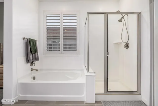 a bathroom with a double vanity sink and mirror