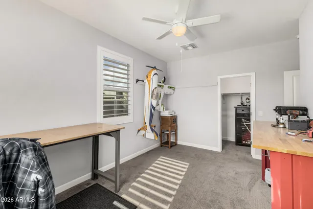 a bedroom with bed and a window