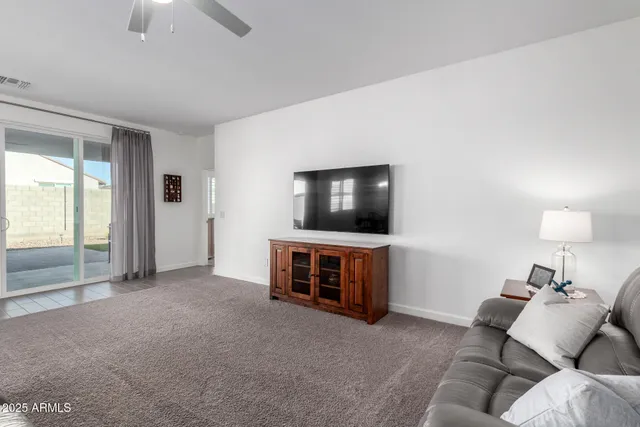 an entryway with wooden floor mirror and a mirror