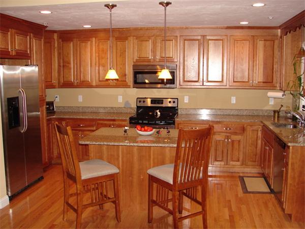 18 Partridge Hill Road Sutton, MA 01590 - Photo 3 of 7 a kitchen with stainless steel appliances granite countertop a stove top oven a refrigerator a sink and dishwasher