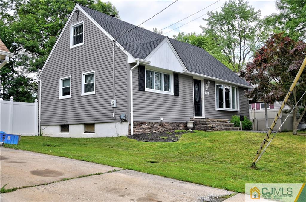 20 Mercer Road Old Bridge, NJ 08857 - Photo 1 of 1 a front view of a house with a yard and garage