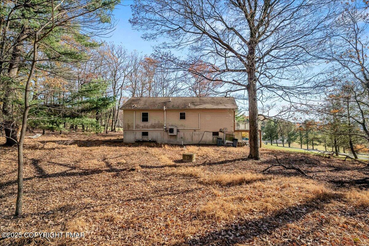 584 Pheasant Road Saylorsburg, PA 18353 - Photo 19 of 21 a view of a house with a large tree