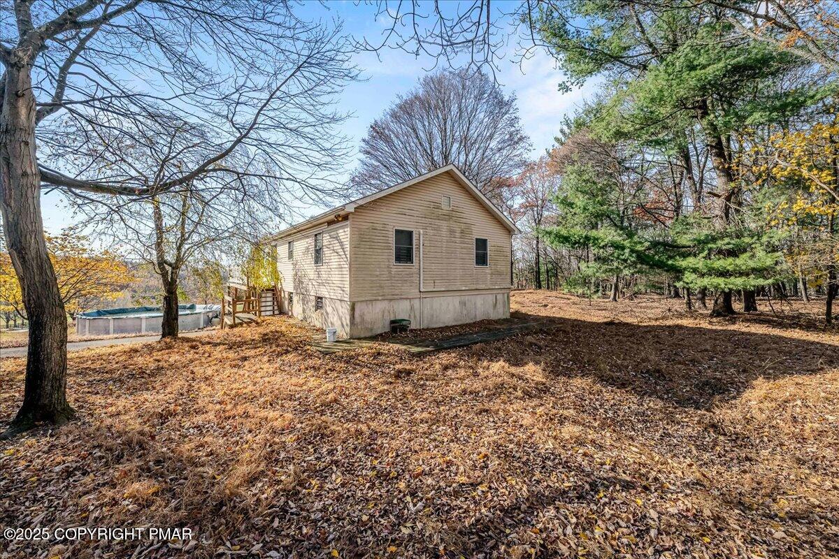 584 Pheasant Road Saylorsburg, PA 18353 - Photo 20 of 21 a view of a house with a yard