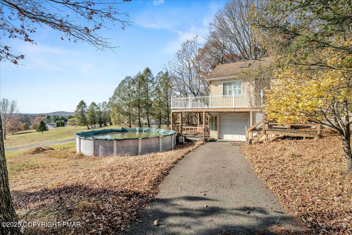 584 Pheasant Road Saylorsburg, PA 18353 - Photo 21 of 21 a view of a lake with a building in the background