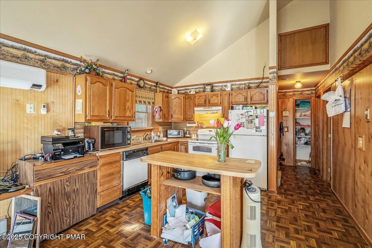 584 Pheasant Road Saylorsburg, PA 18353 - Photo 6 of 21 a kitchen with stainless steel appliances a sink and a refrigerator