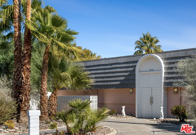 a vase of flowers sitting on a floor