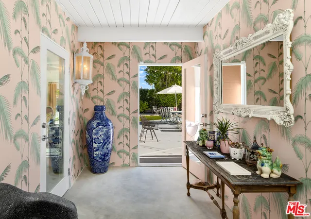 a view of a entryway with furniture and garden