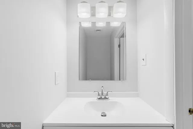 a view of a hallway with stairs