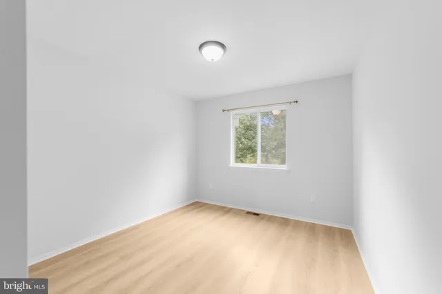 a bathroom with a toilet a sink a mirror and bathtub