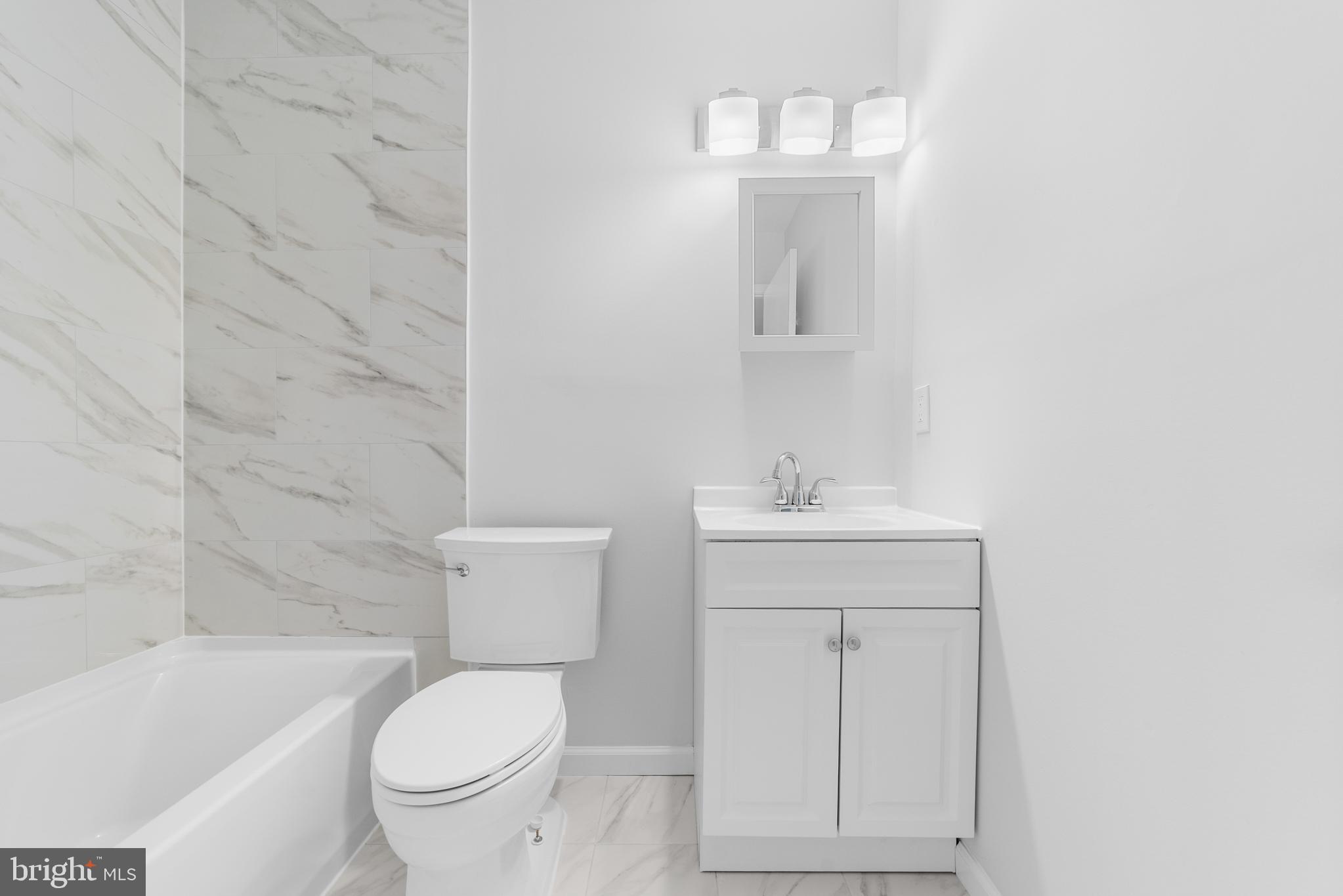 31 Phoenix Court Sewell, NJ 08080 - Photo 17 of 24 a bathroom with a toilet a sink a mirror and bathtub