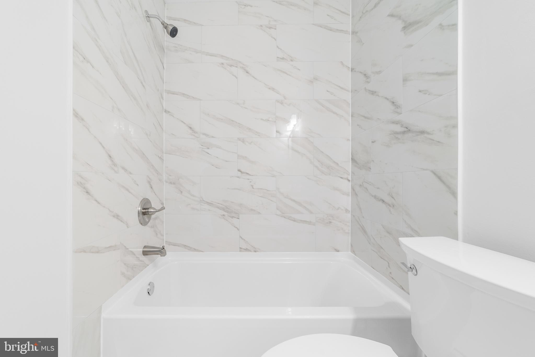 31 Phoenix Court Sewell, NJ 08080 - Photo 18 of 24 a bathroom with a bathtub and a toilet