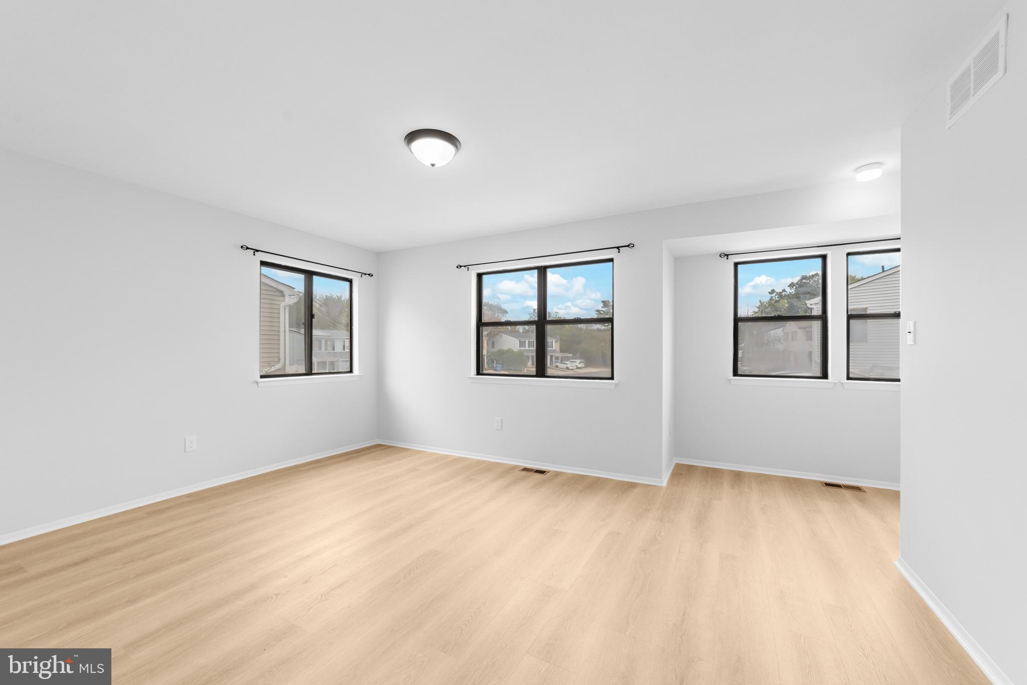 31 Phoenix Court Sewell, NJ 08080 - Photo 19 of 24 a view of an empty room with wooden floor and a window