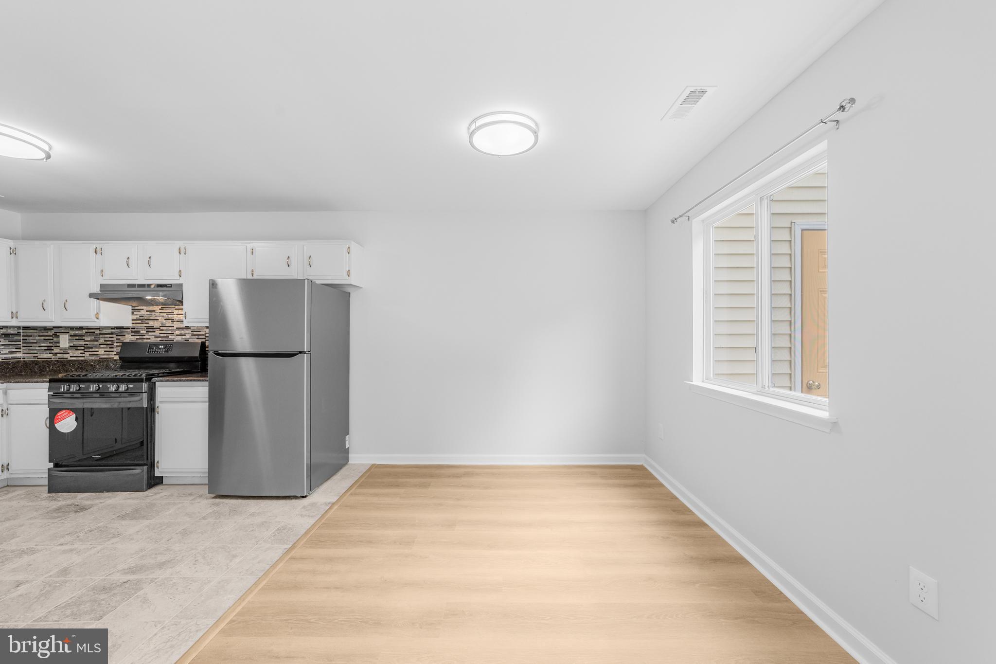 31 Phoenix Court Sewell, NJ 08080 - Photo 6 of 24 a kitchen with stainless steel appliances a refrigerator and a stove