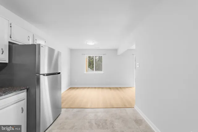 a view of an empty room with a fireplace