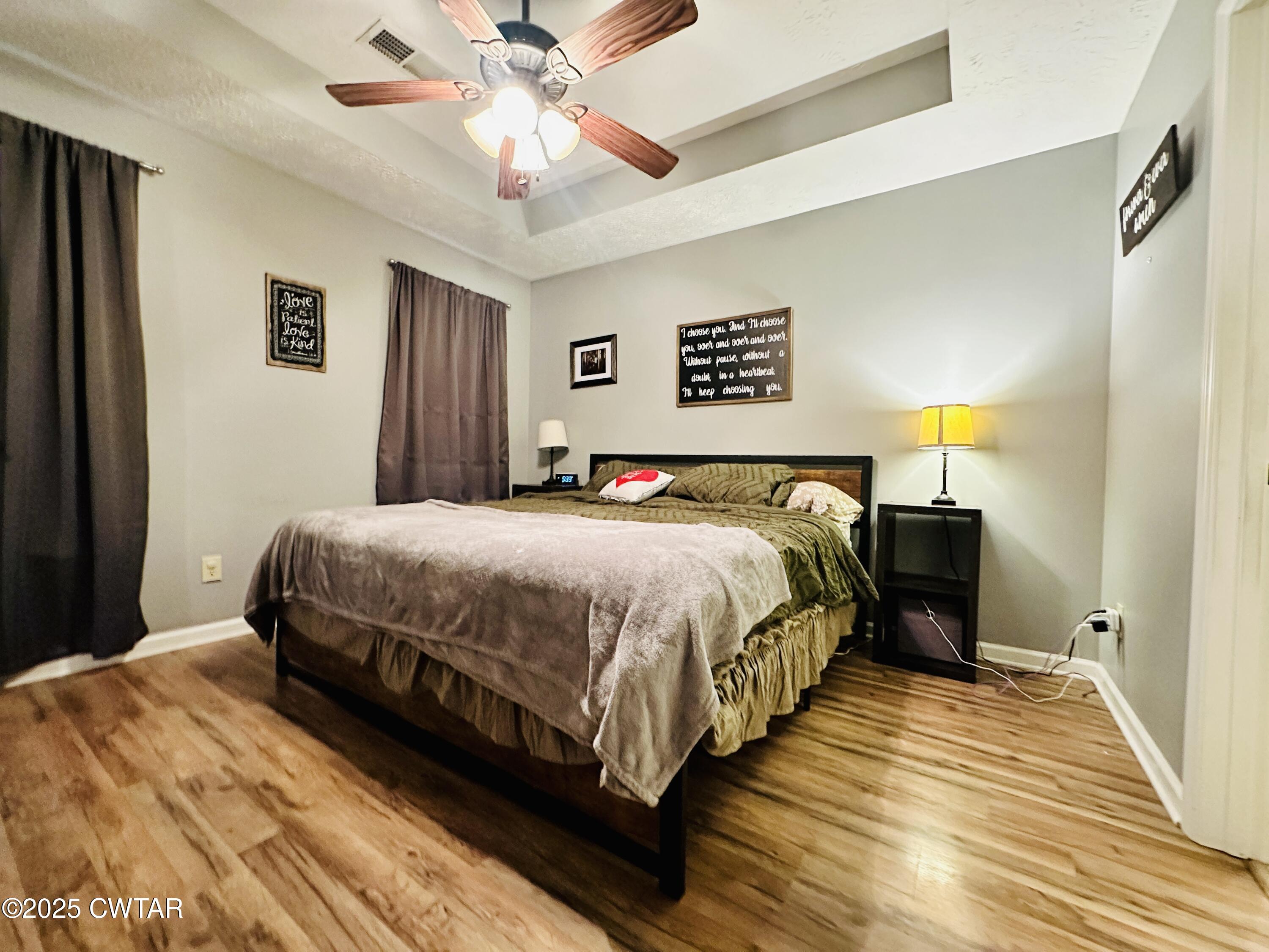 75 Bray Lane Beech Bluff, TN 38313 - Photo 13 of 25 a bedroom with a bed and wooden floor