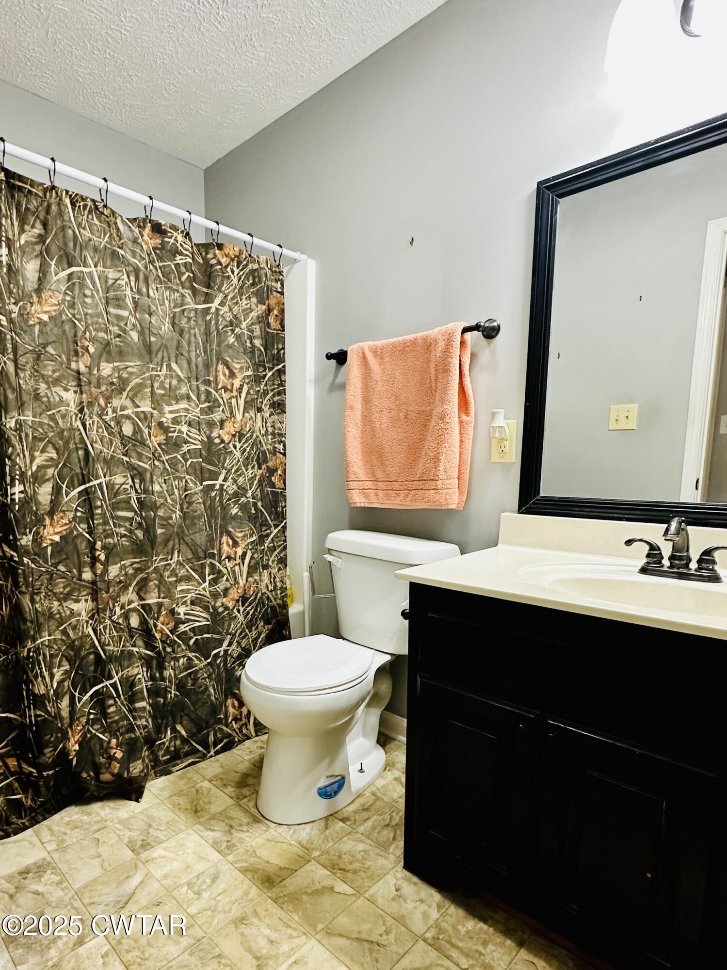 75 Bray Lane Beech Bluff, TN 38313 - Photo 20 of 25 a bathroom with a sink toilet and mirror