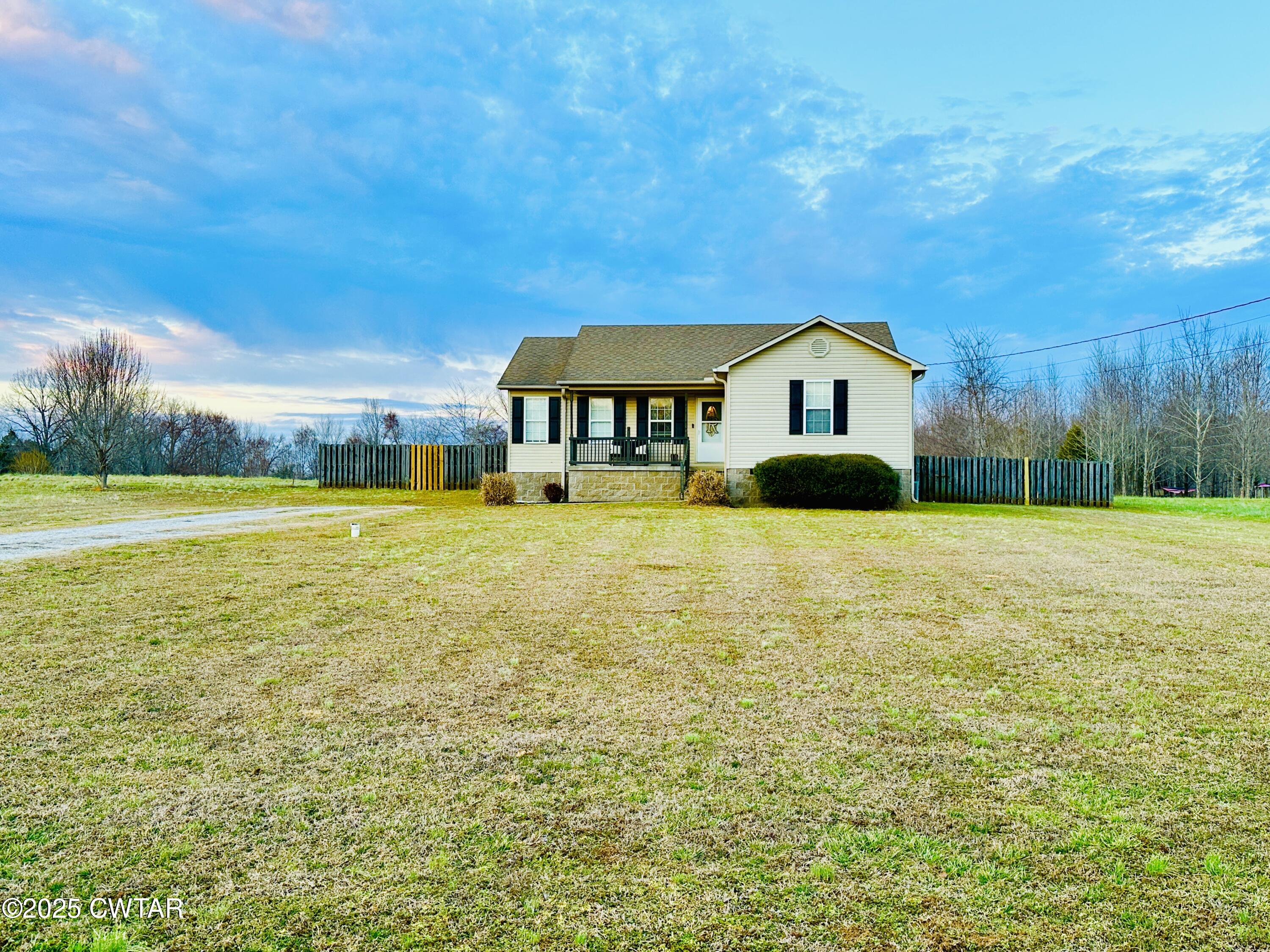 75 Bray Lane Beech Bluff, TN 38313 - Photo 3 of 25 a view of a house with a big yard and large trees