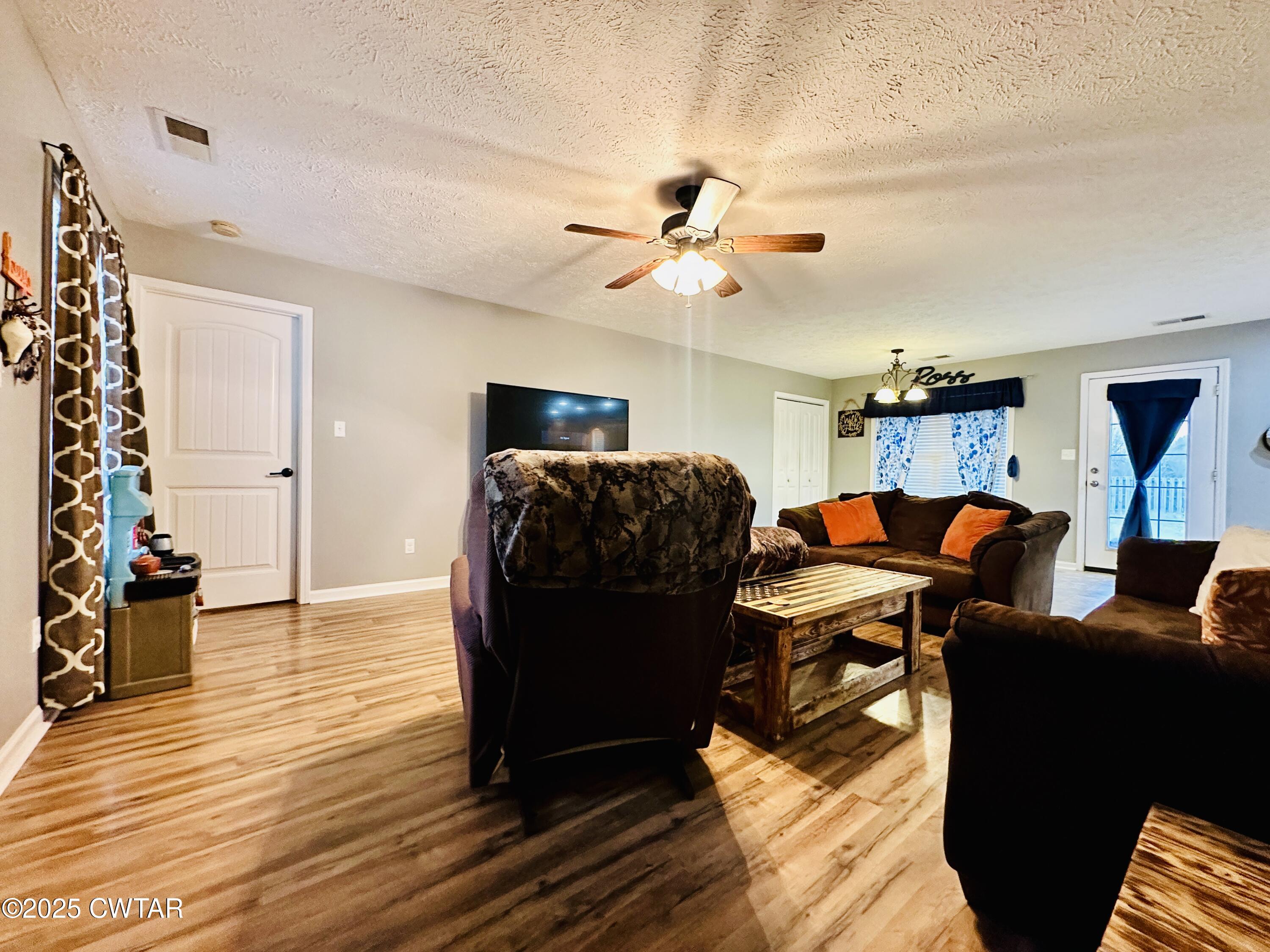 75 Bray Lane Beech Bluff, TN 38313 - Photo 6 of 25 a living room with furniture and wooden floor