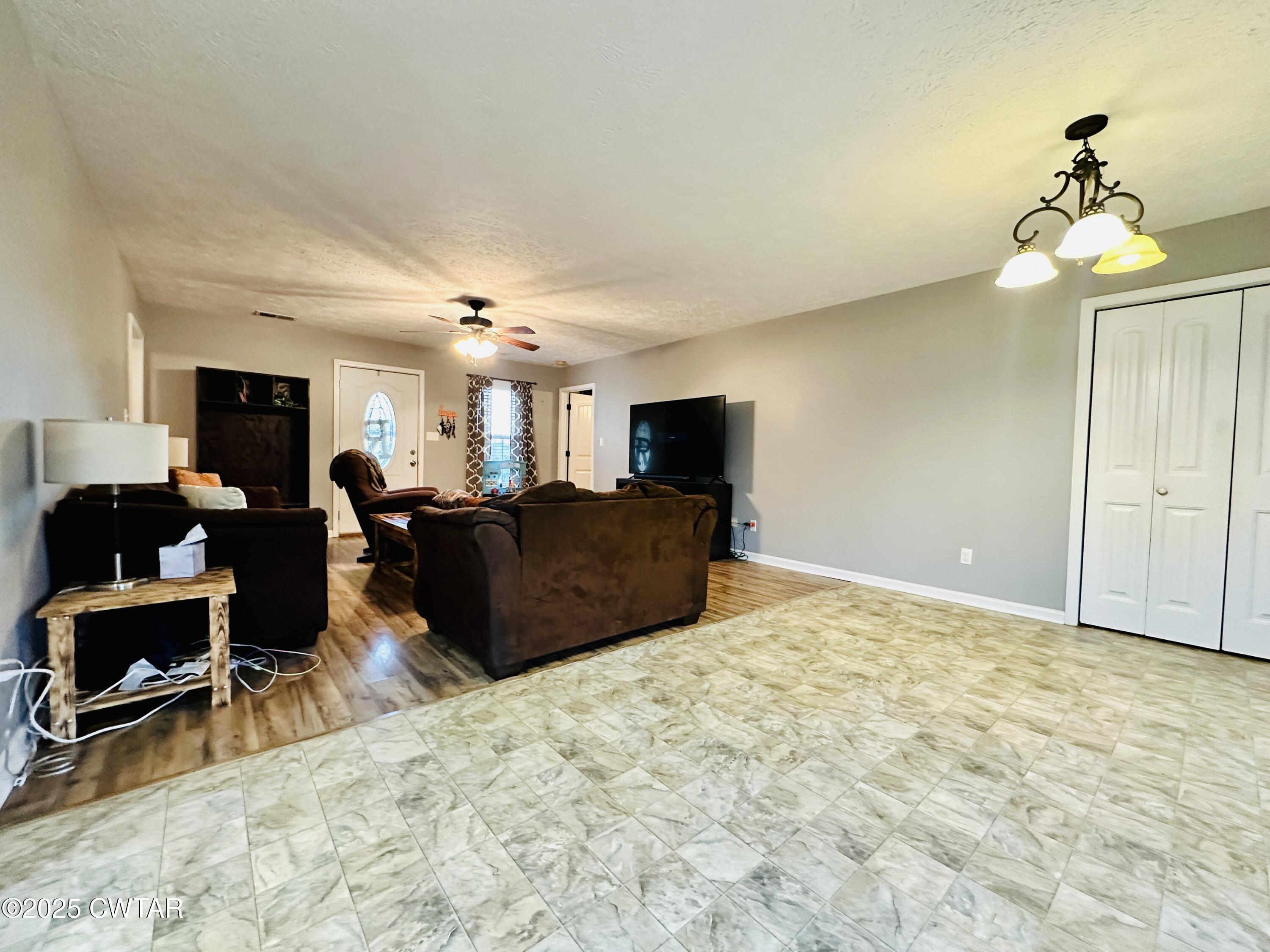 75 Bray Lane Beech Bluff, TN 38313 - Photo 8 of 25 a bed room with furniture and a chandelier