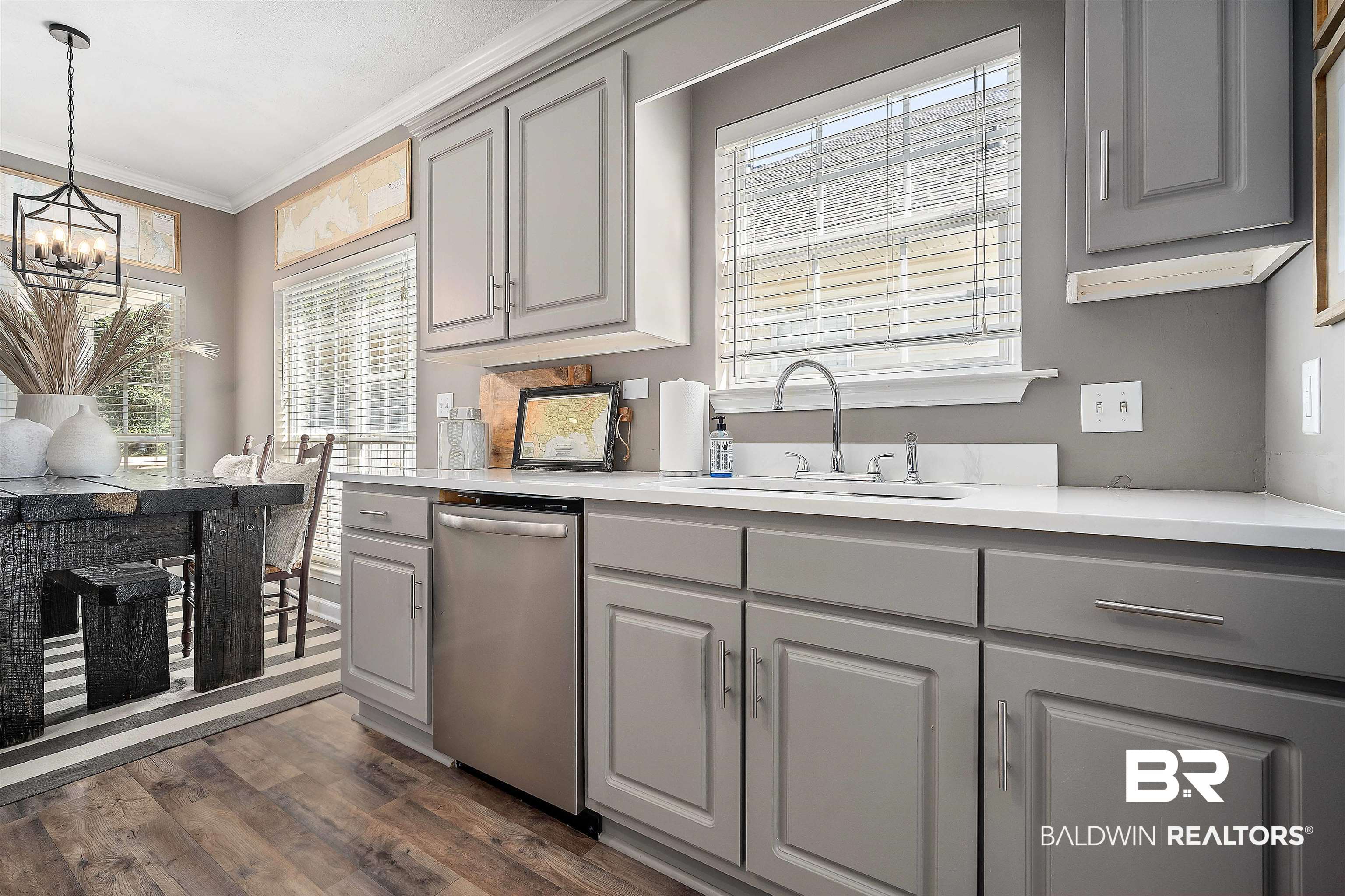 27288 Parker Lane Daphne, AL 36526 - Photo 6 of 29 Kitchen with gray cabinetry, stainless steel dishwasher, crown molding, pendant lighting, and dark wood-type flooring