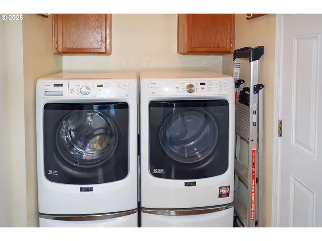 a utility room with dryer and washer