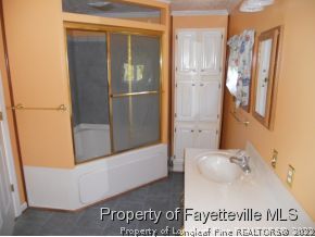109 Welsh Road Raeford, NC 28376 - Photo 5 of 7 a bathroom with bathtub and shower