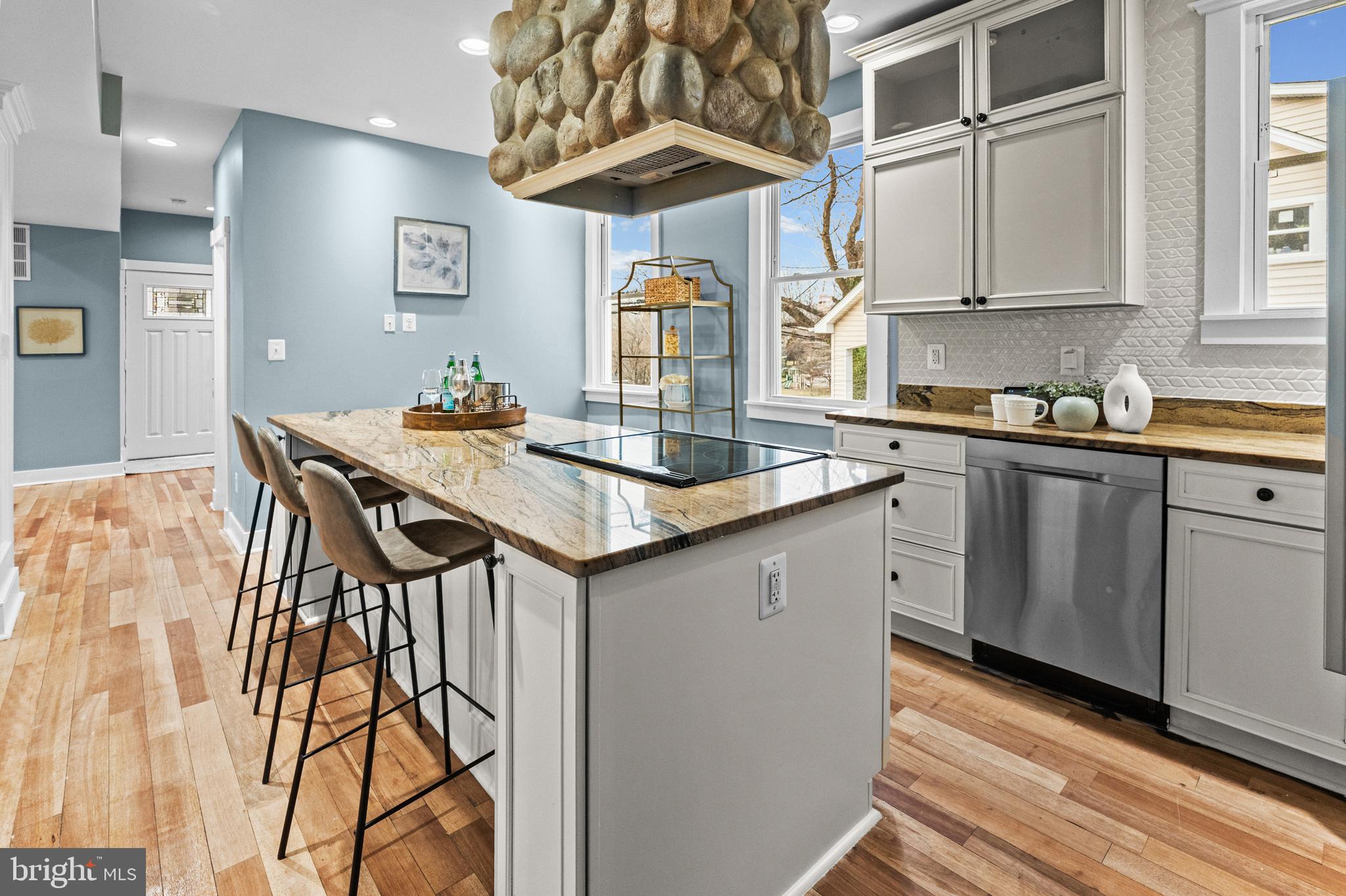 4604 Moravia Road Baltimore, MD 21206 - Photo 11 of 50 a kitchen with stainless steel appliances granite countertop a kitchen island a stove a table and chairs in it