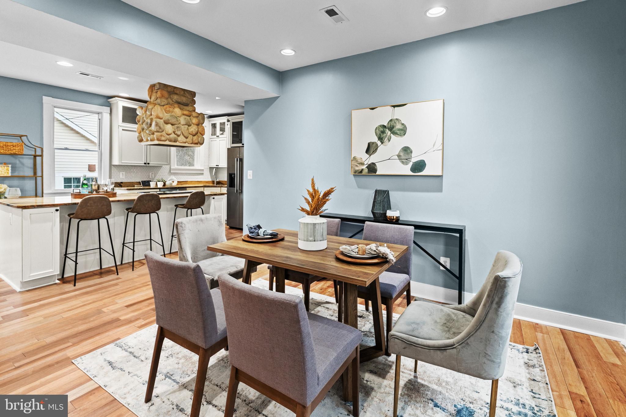 4604 Moravia Road Baltimore, MD 21206 - Photo 12 of 50 a view of a dining room with furniture and wooden floor